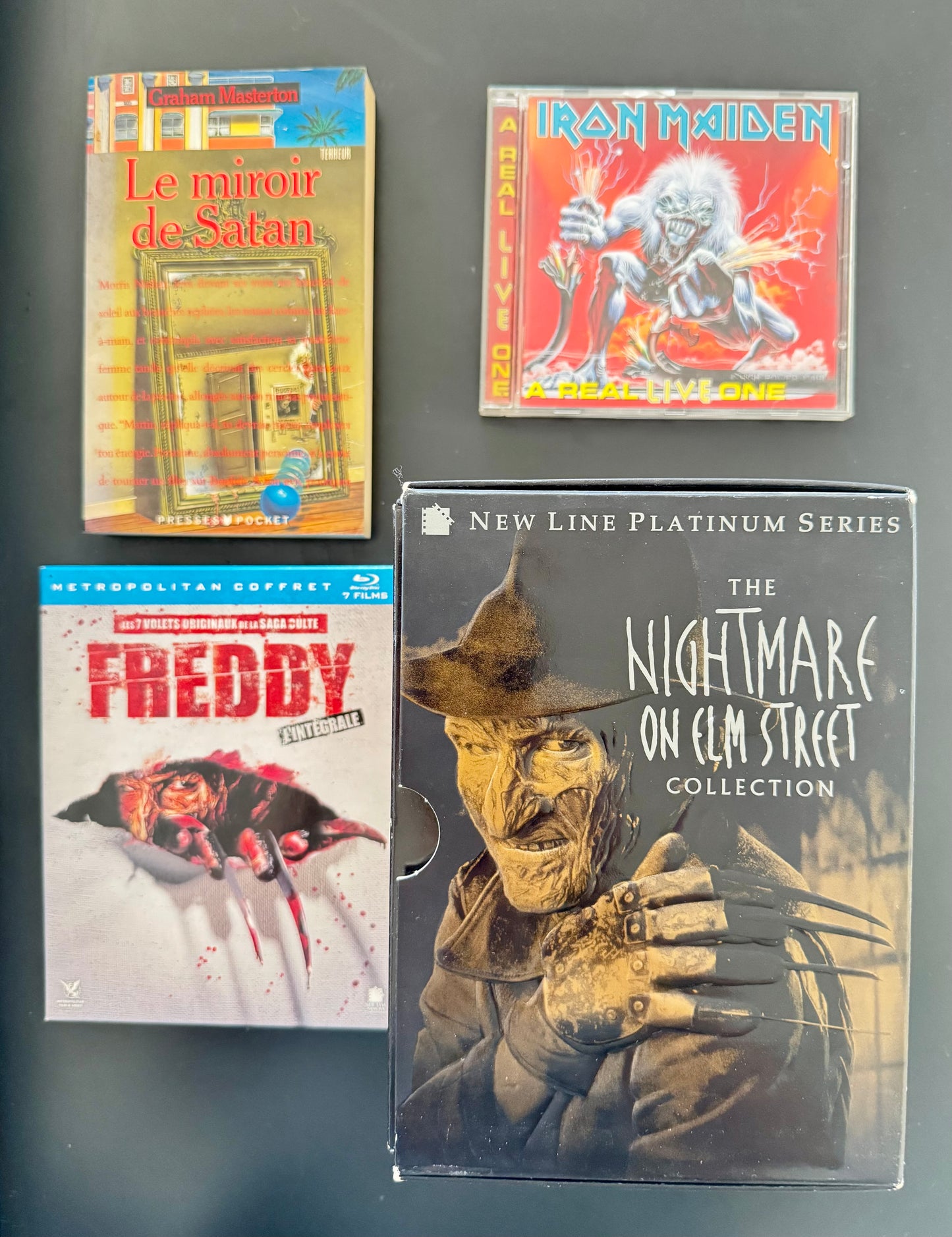 Pack Freddy Krueger — Coffret Nightmare on Elm Street + Nightmare on Elm Street Collection (DVD US New Line Platinum) + Graham Masterton Le miroir de Satan (livre) + Iron Maiden A Real Live One (CD)